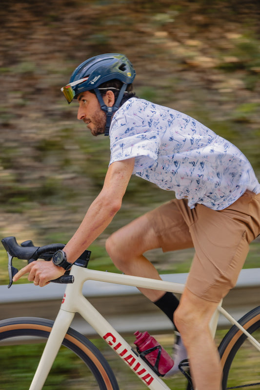 cyclist with our pamera shirt inspired by the sea and gravel cargo pants to carry the cell phone